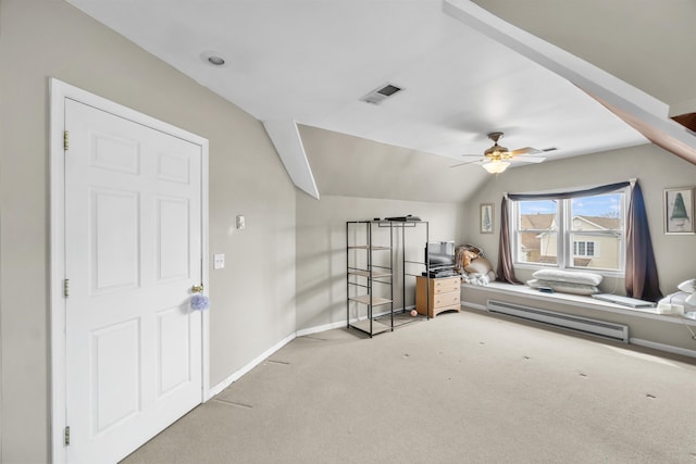 bedroom with light carpet, baseboards, visible vents, lofted ceiling, and baseboard heating