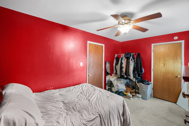 carpeted bedroom featuring a ceiling fan