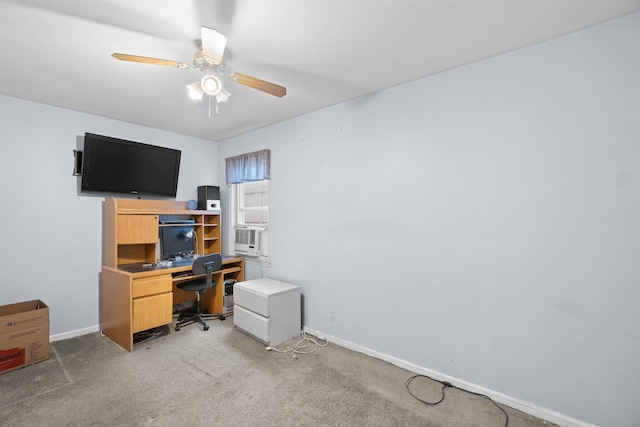 office area with ceiling fan, baseboards, cooling unit, and light colored carpet