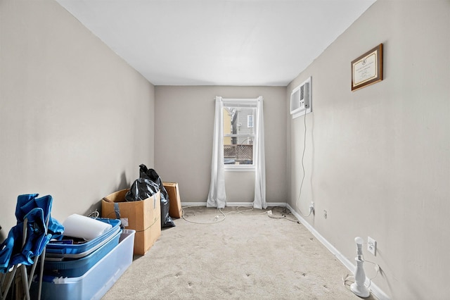 interior space with an AC wall unit and baseboards