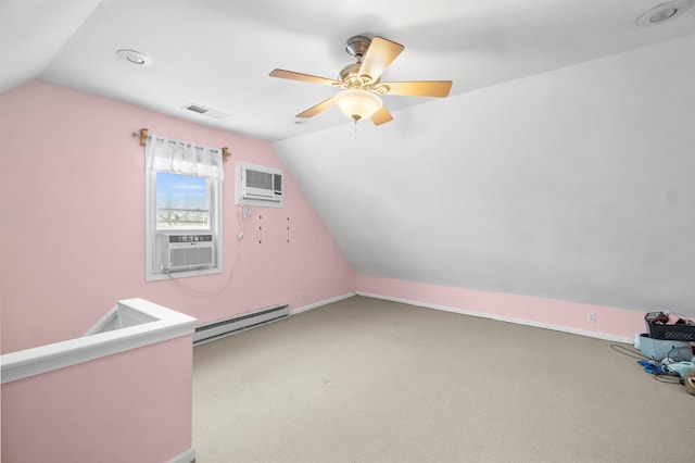 bonus room with visible vents, vaulted ceiling, baseboard heating, and a wall mounted AC