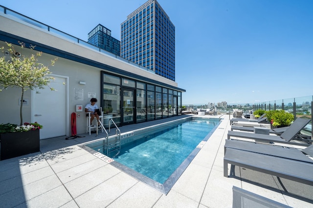 view of swimming pool with a patio area