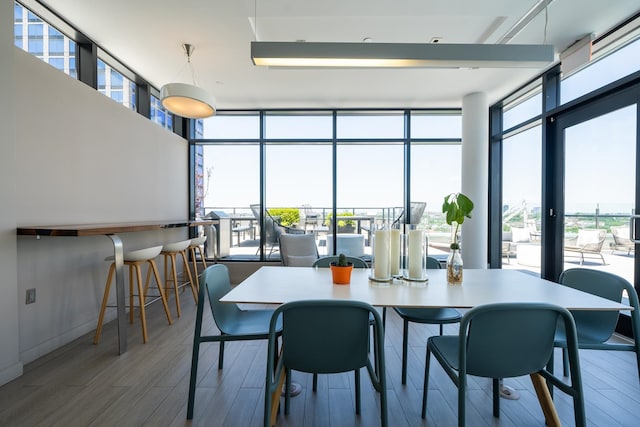 dining area featuring hardwood / wood-style floors and floor to ceiling windows