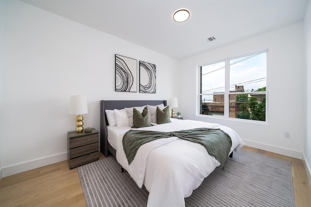 bedroom with light wood-type flooring