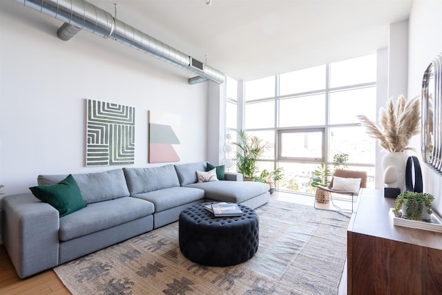 234 10th St Unit 606, Jersey City, NJ 07302 - living area featuring expansive windows and wood finished floors