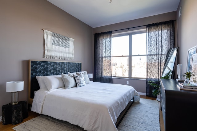 234 10th St Unit 606, Jersey City, NJ 07302 - bedroom with wood finished floors and multiple windows