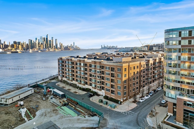 aerial view with a city view and a water view