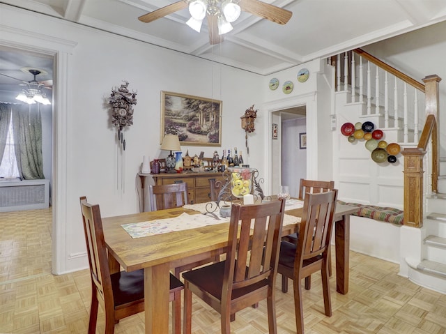 dining area with beam ceiling, stairway, coffered ceiling, and a ceiling fan