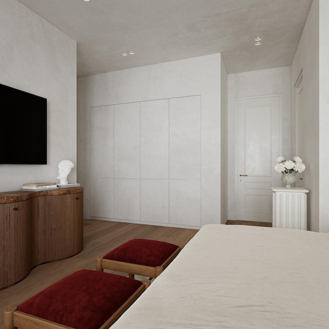 bedroom with light wood-type flooring