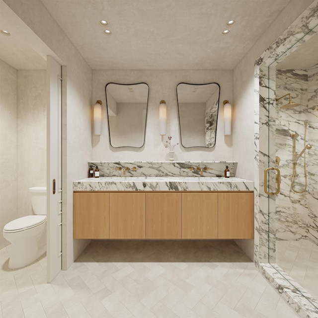 bathroom with vanity, a shower with shower door, and toilet