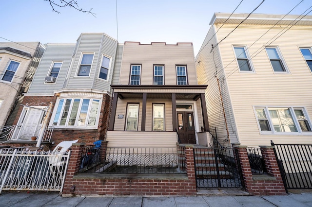 multi unit property featuring a porch