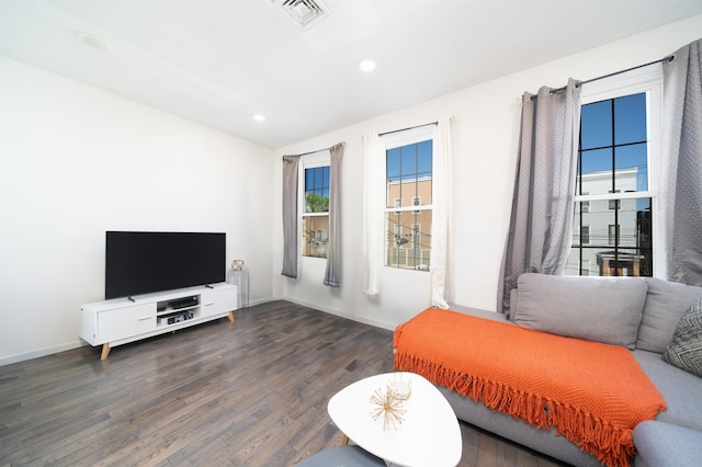 sitting room featuring dark hardwood / wood-style flooring and radiator heating unit