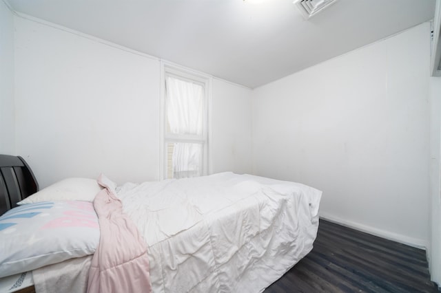 bedroom featuring dark wood-type flooring