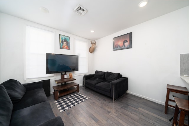 living room with dark hardwood / wood-style flooring