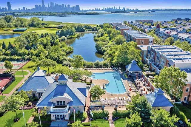 drone / aerial view featuring a view of city and a water view