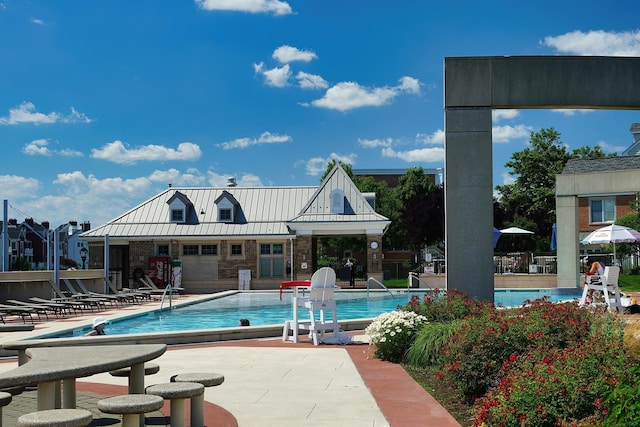 community pool with a patio area