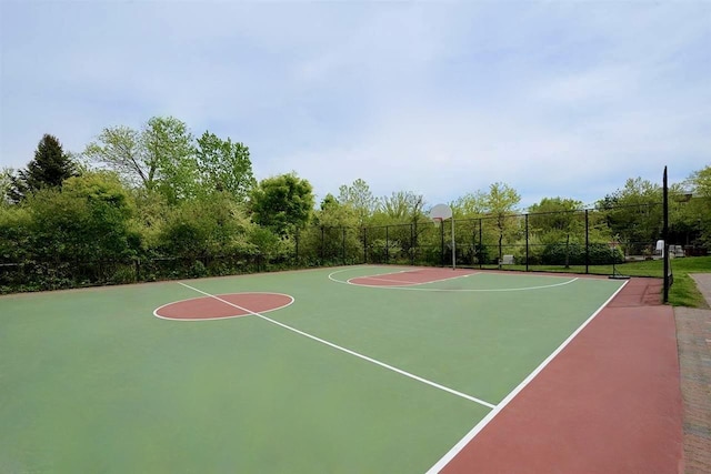 view of basketball court featuring community basketball court and fence