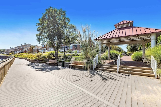 wooden deck featuring a residential view and a gazebo