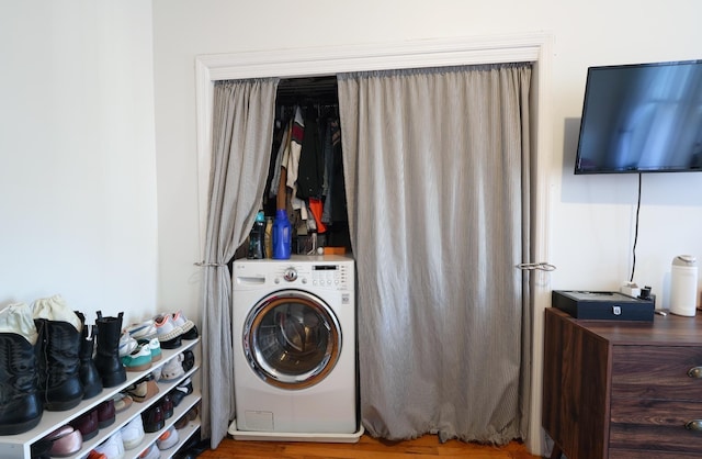 laundry area featuring washer / dryer and wood-type flooring