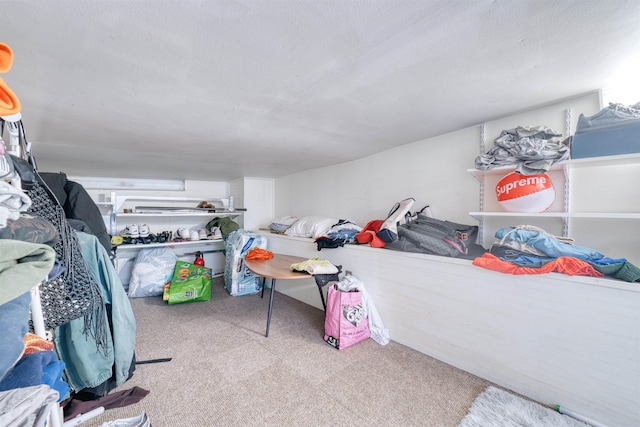 carpeted bedroom featuring a textured ceiling