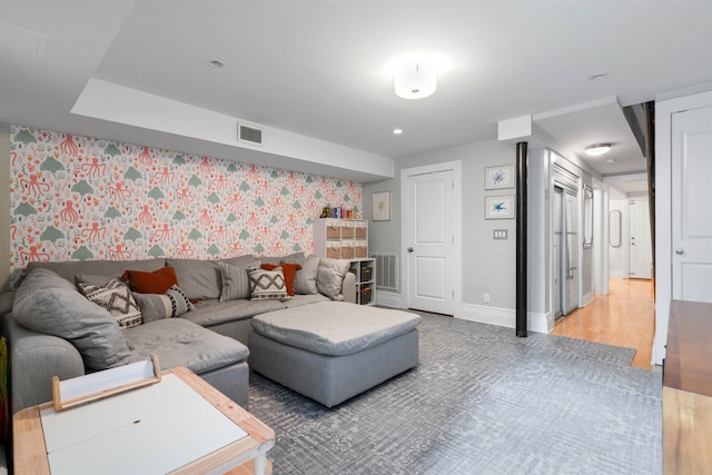 275 5th St Unit 1, Jersey City, NJ 07302 - living room with wallpapered walls and light wood-style flooring