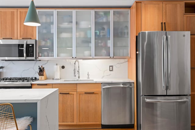 275 5th St Unit 1, Jersey City, NJ 07302 - kitchen featuring stainless steel appliances, tasteful backsplash, glass insert cabinets, and light stone counters