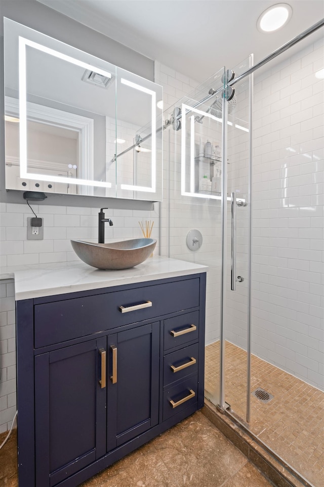 275 5th St Unit 1, Jersey City, NJ 07302 - full bath featuring a stall shower, vanity, tile walls, and decorative backsplash
