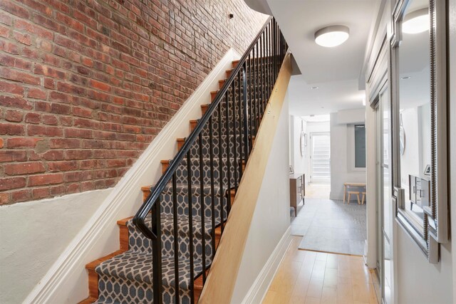 275 5th St Unit 1, Jersey City, NJ 07302 - stairs with baseboards and wood finished floors
