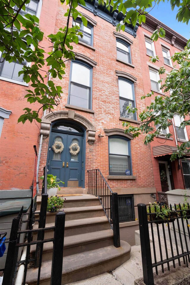 275 5th St Unit 1, Jersey City, NJ 07302 - view of exterior entry featuring brick siding
