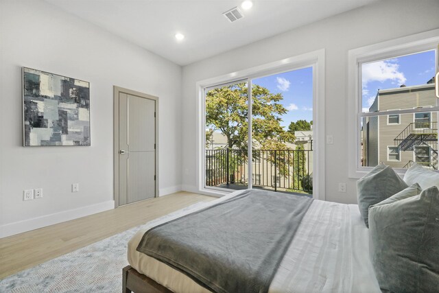 44 Bleecker St Unit 2, Jersey City, NJ 07307 - bedroom with wood finished floors, access to outside, baseboards, and recessed lighting