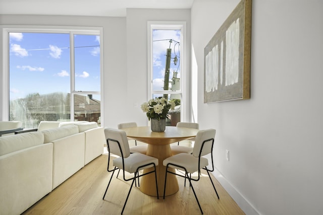 44 Bleecker St Unit 2, Jersey City, NJ 07307 - dining space featuring light wood-style flooring and baseboards