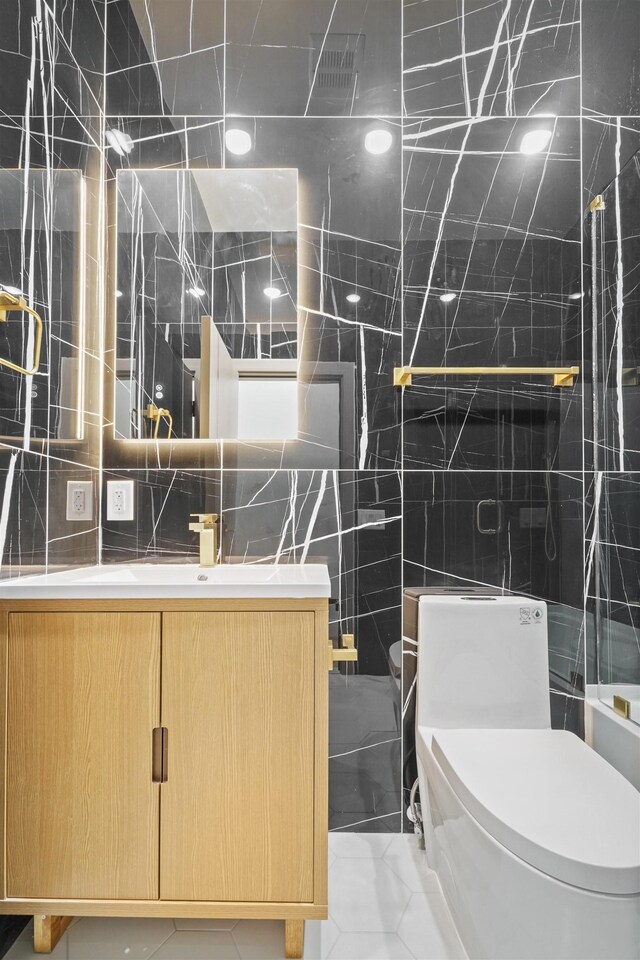 44 Bleecker St Unit 2, Jersey City, NJ 07307 - full bathroom featuring toilet, tile walls, vanity, and a tile shower
