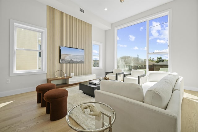 44 Bleecker St Unit 2, Jersey City, NJ 07307 - living area with light wood finished floors, plenty of natural light, and baseboards