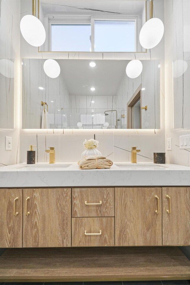 44 Bleecker St Unit 2, Jersey City, NJ 07307 - bathroom with double vanity and a shower stall