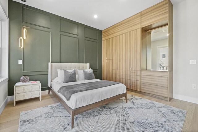 44 Bleecker St Unit 2, Jersey City, NJ 07307 - bedroom featuring baseboards, light wood-style floors, and recessed lighting