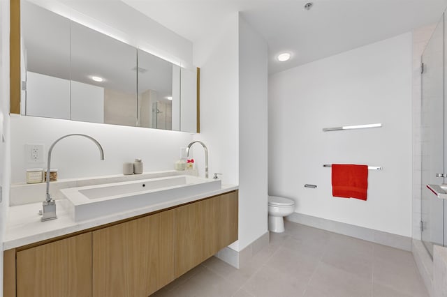 77 Hudson St Unit 3603, Jersey City, NJ 07302 - bathroom featuring tiled shower, vanity, toilet, and tile patterned flooring