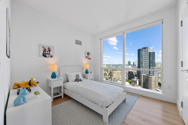 77 Hudson St Unit 3603, Jersey City, NJ 07302 - bedroom featuring light wood finished floors and a city view