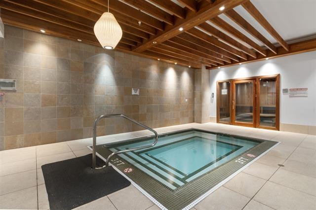 view of pool featuring an indoor hot tub