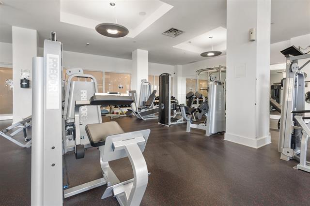 exercise room featuring a tray ceiling