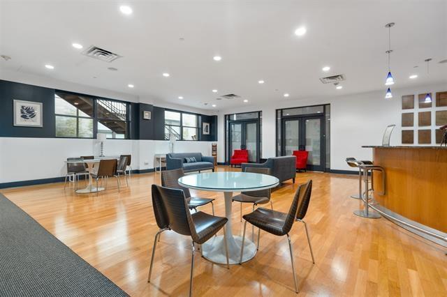 dining space featuring light hardwood / wood-style floors and french doors