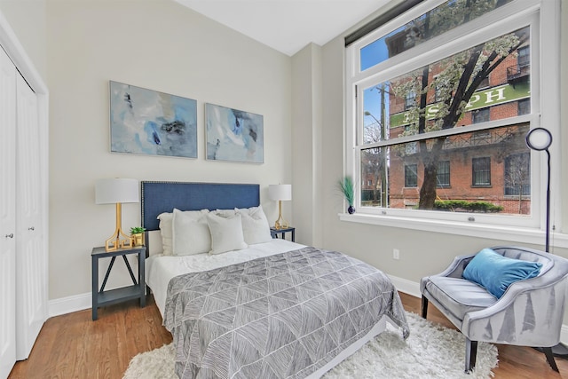 167 Wayne St Unit 105, Jersey City, NJ 07302 - bedroom featuring baseboards, wood finished floors, and a closet