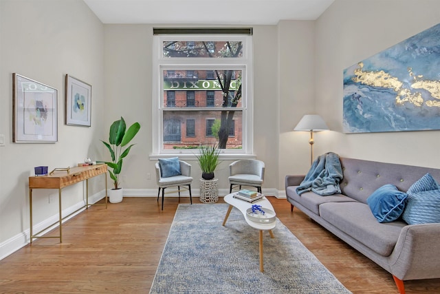 167 Wayne St Unit 105, Jersey City, NJ 07302 - living area with baseboards and wood finished floors