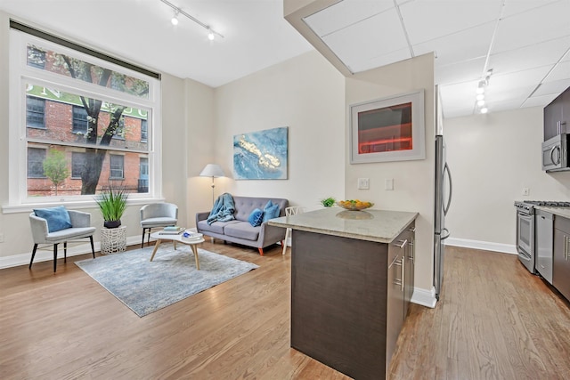 167 Wayne St Unit 105, Jersey City, NJ 07302 - interior space featuring baseboards, track lighting, and light wood-style flooring