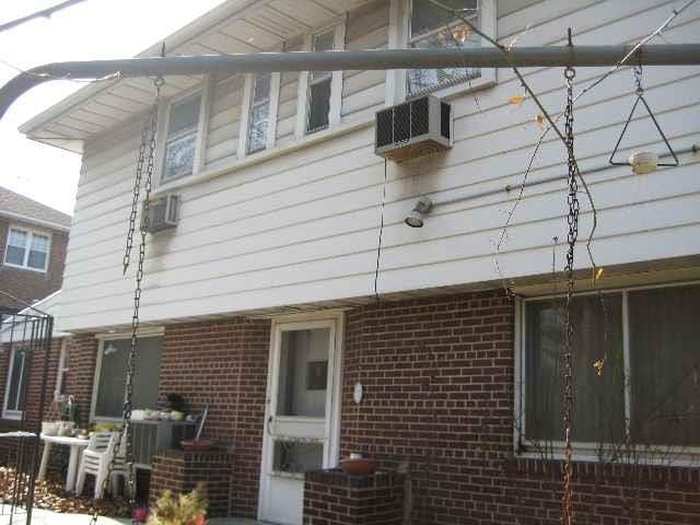 view of side of property featuring cooling unit