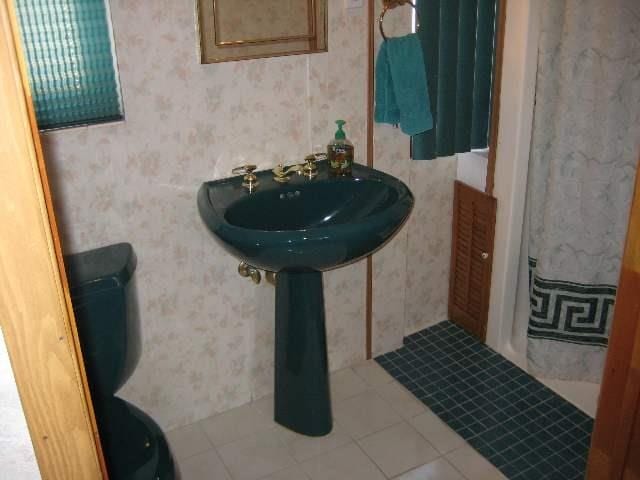 bathroom featuring tile patterned floors and toilet