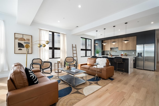 living room with light hardwood / wood-style flooring