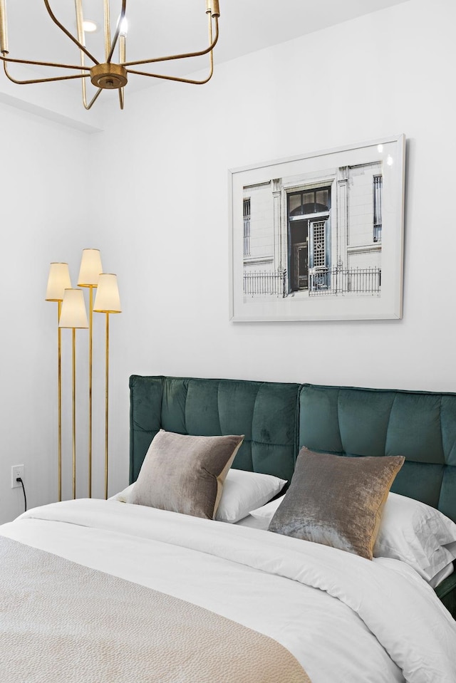 bedroom with an inviting chandelier