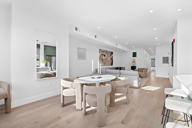 dining space featuring light hardwood / wood-style flooring