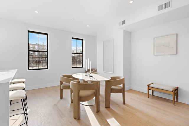 dining room with light wood-type flooring