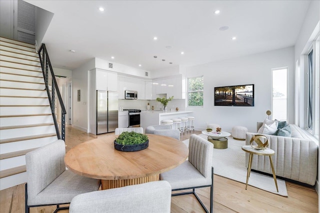 63 Stegman St Unit 2, Jersey City, NJ 07305 - dining area featuring stairs, light wood finished floors, and recessed lighting